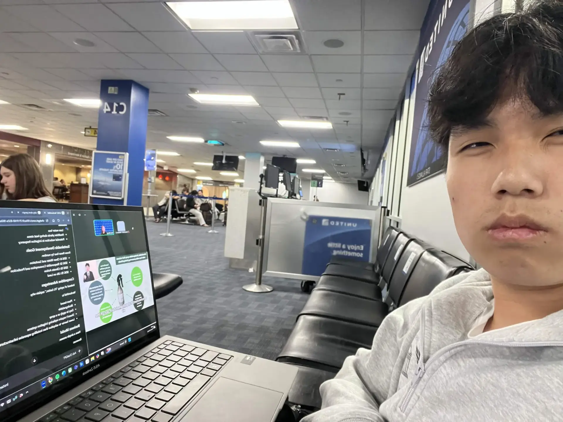 Brendan working on his laptop while traveling
