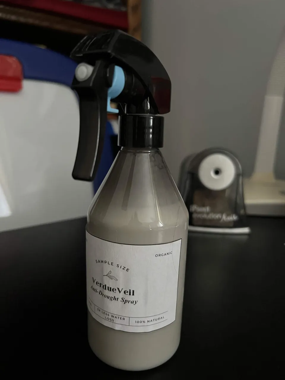 A sample bottle of VerdureVeil Anti-Drought Spray
