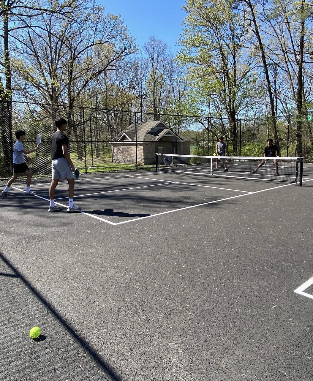 Match Point Foundation participants playing pickleball on an outdoor court