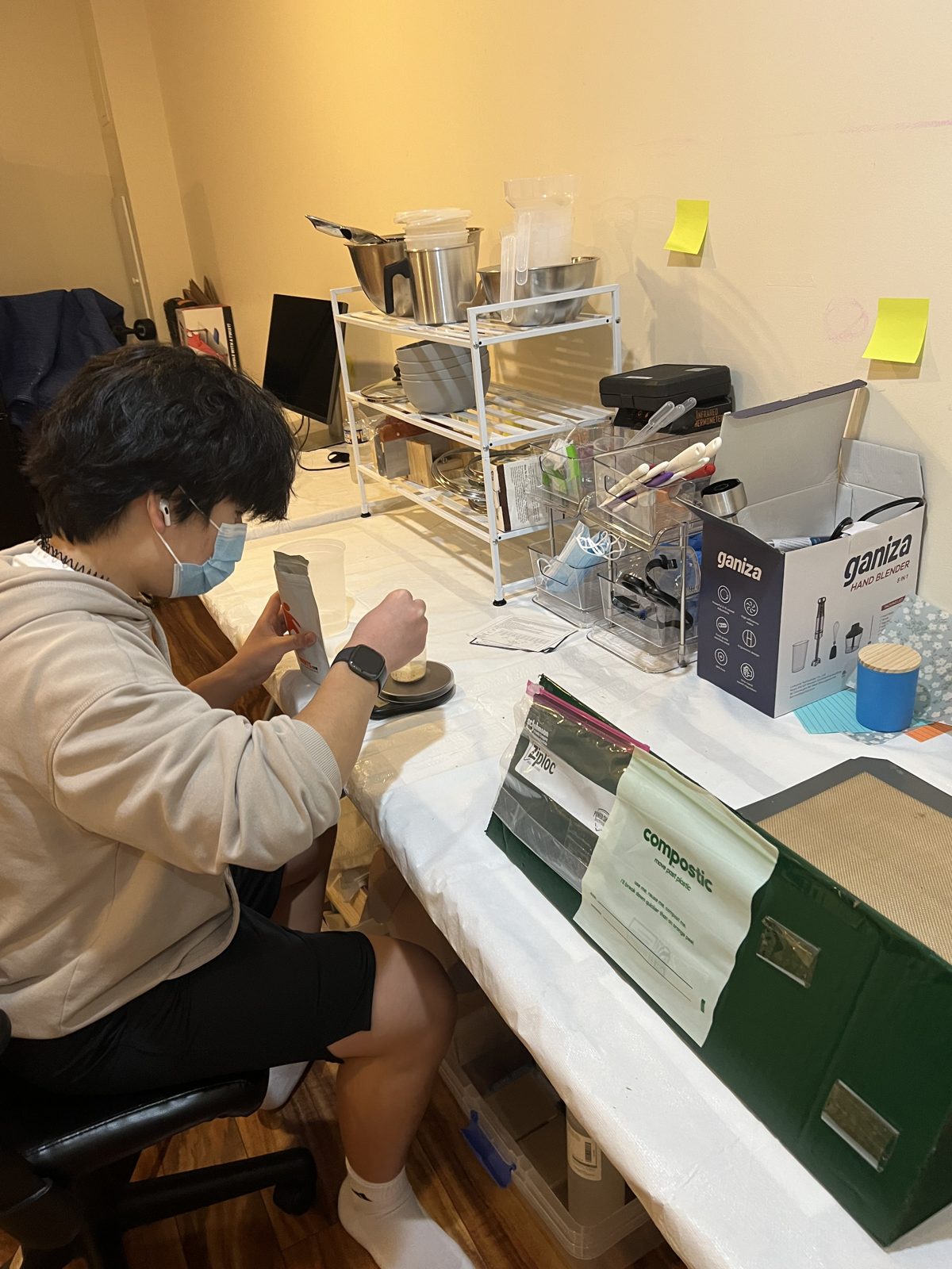 Brendan testing material samples at his workbench